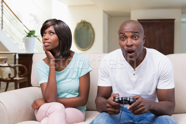 Unatkozik nő ül fiúbarát játszik videojátékok Stock fotó © wavebreak_media