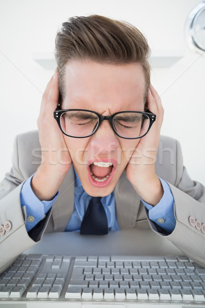 Angry businessman working on computer Stock photo © wavebreak_media