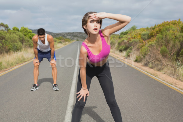 Couple running on the open road together Stock photo © wavebreak_media