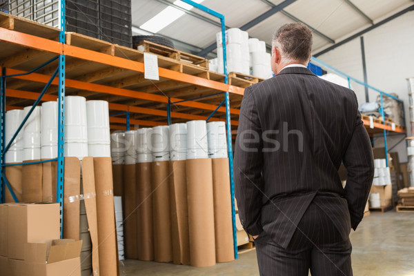 Rear view of manager standing with hands in the pocket Stock photo © wavebreak_media