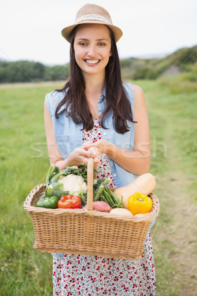 Pretty woman with basket of veg Stock photo © wavebreak_media