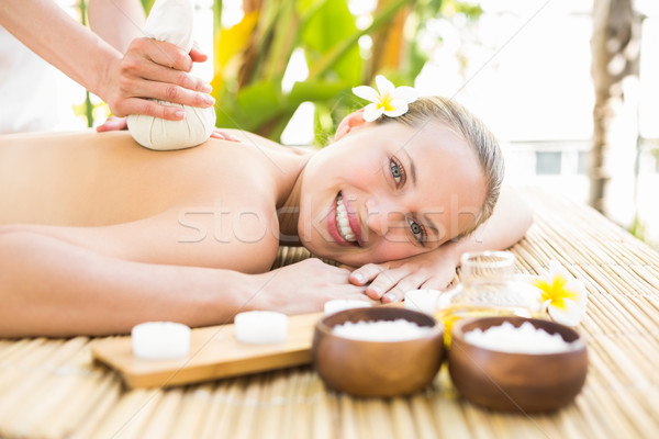 Stock photo: Attractive woman getting massage on her back