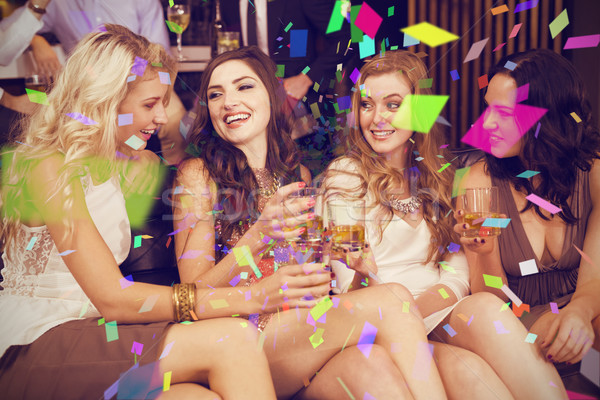 Composite image of pretty friends having a drink together Stock photo © wavebreak_media