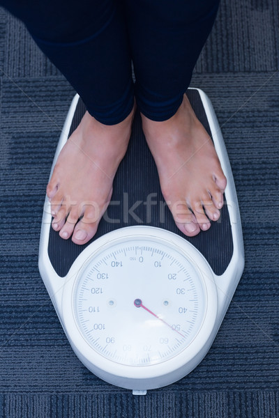 Close up of a woman standing on the scales Stock photo © wavebreak_media