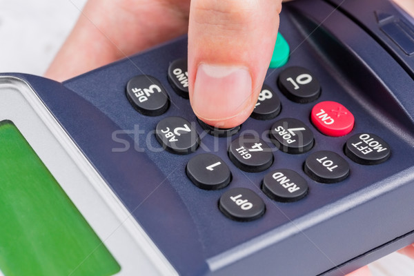 Man entering his pin on terminal Stock photo © wavebreak_media
