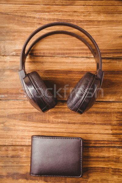 Musique casque portefeuille table en bois [[stock_photo]] © wavebreak_media