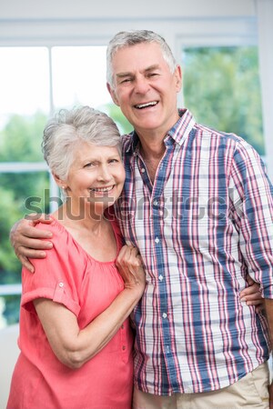 Portrait of smiling boy with grandfather sitting by wall Stock photo © wavebreak_media