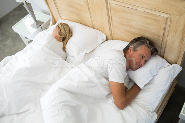 Pareja cama argumento dormitorio hombre casa Foto stock © wavebreak_media