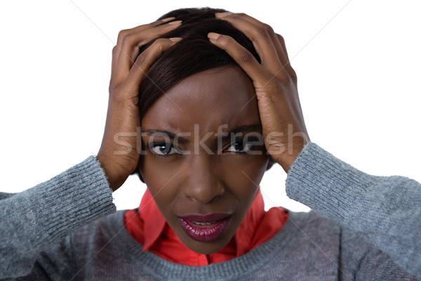 Portrait of frustrated woman with head in hand Stock photo © wavebreak_media
