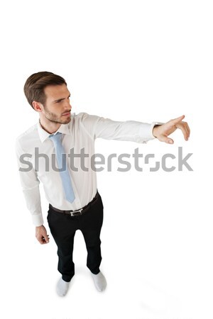 High angle view of businessman touching invisible interface Stock photo © wavebreak_media