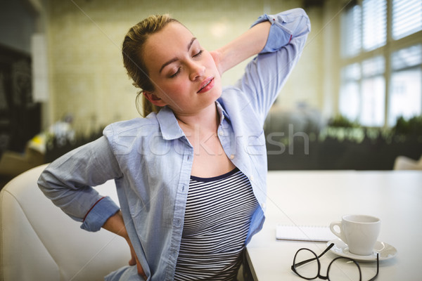 疲れ 女性実業家 ストレッチング 創造 オフィス ビジネス ストックフォト © wavebreak_media