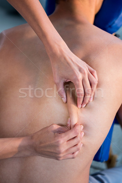 Maakt een reservekopie massage patiënt kliniek man professionele Stockfoto © wavebreak_media