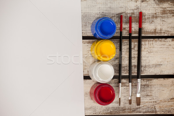 Stock photo: Watercolor paints, paint brushes and white paper