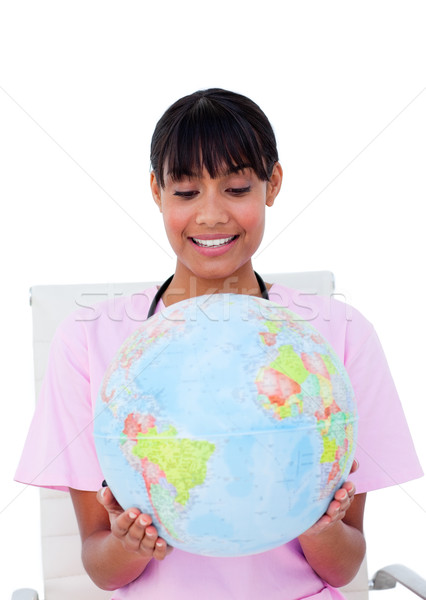 Portrait of a beautiful female doctor holding a terrestrial glob Stock photo © wavebreak_media