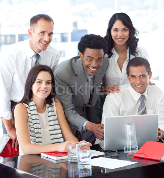 Stock photo: Happy multi-ethnic business team working together in office