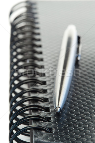 Black agenda and pen on a white background Stock photo © wavebreak_media