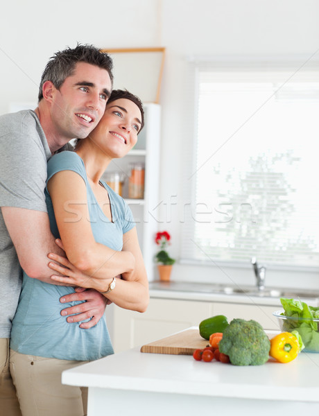 Smiling Man and woman hugging in a kitchen Stock photo © wavebreak_media