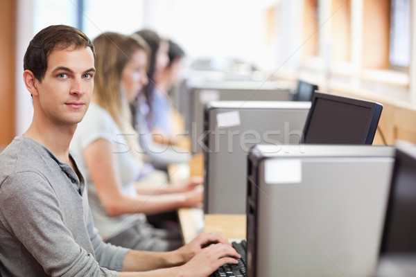 Homme étudiant posant ordinateur chambre éducation [[stock_photo]] © wavebreak_media
