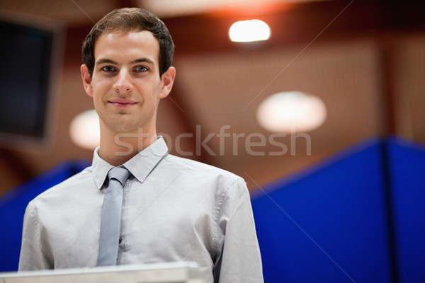 Stock photo: Man doing a presentation while looking at the camera