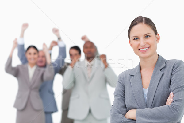 Zâmbitor femeie de afaceri echipă in spatele alb Imagine de stoc © wavebreak_media