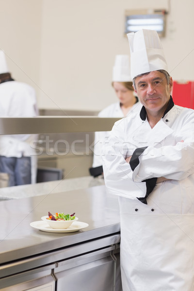 Smiling chef with his salad in the kitchen Stock photo © wavebreak_media