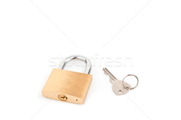 Padlock and key against white background Stock photo © wavebreak_media