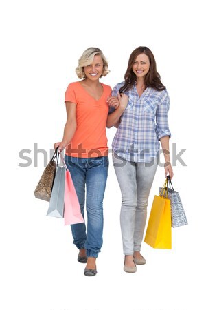 Two cheerful friends with shopping bags Stock photo © wavebreak_media