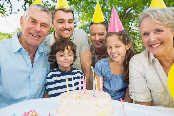 Family with cake outdoors Stock photo © wavebreak_media