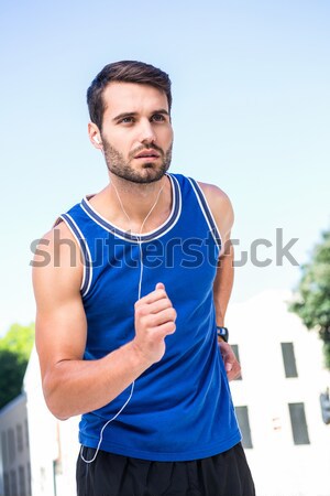 Portrait of a young sporty man running Stock photo © wavebreak_media