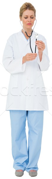 Blonde doctor listening with stethoscope Stock photo © wavebreak_media