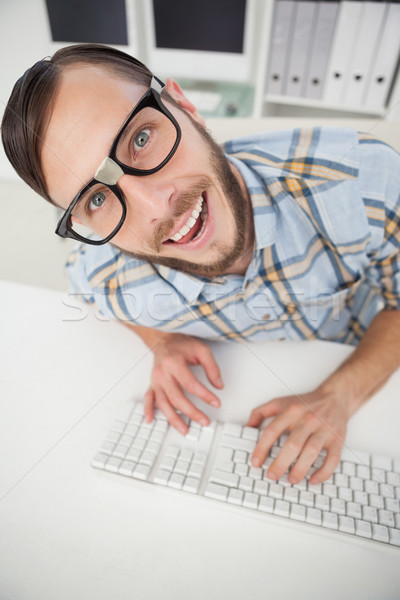 Nerdy businessman working on computer Stock photo © wavebreak_media