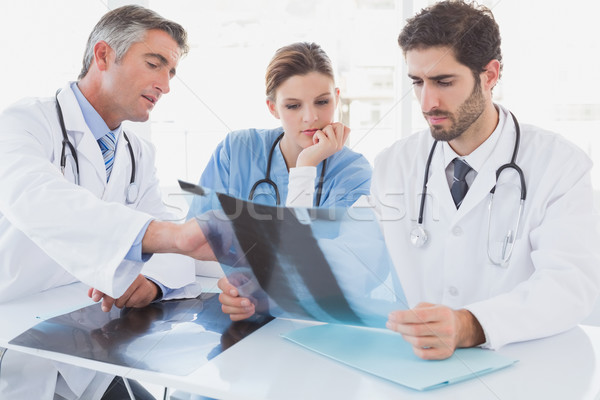 Doctors sitting together with x-rays Stock photo © wavebreak_media