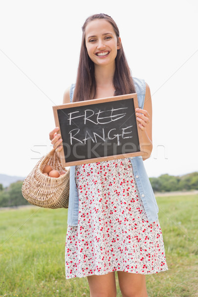 Woman holding basket of free range eggs Stock photo © wavebreak_media