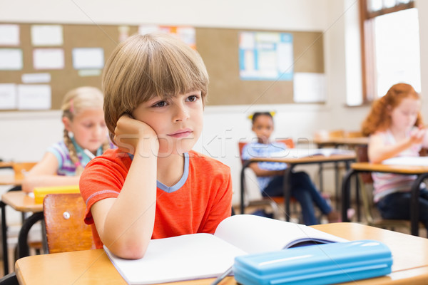 Concentrate pupils sitting at his desk  Stock photo © wavebreak_media