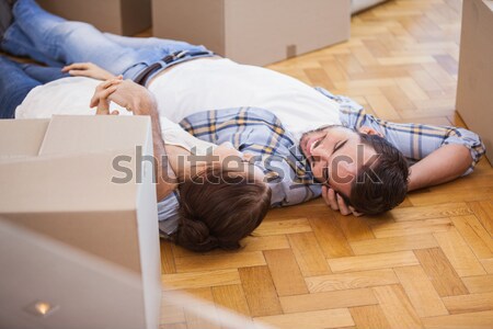 Worker lying on the floor in warehouse Stock photo © wavebreak_media