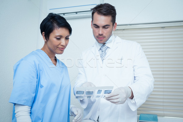 Stock photo: Dentists looking at x-ray