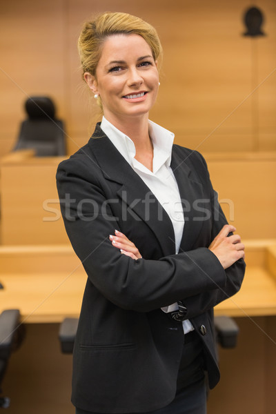 Stock photo: Smiling lawyer looking at camera