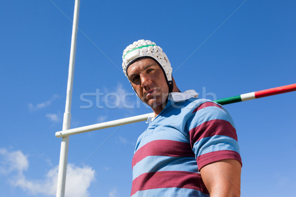 Portrait of rugby player wearing white helmet against blue sky Stock photo © wavebreak_media