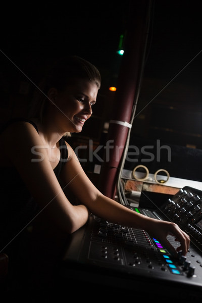 Female audio engineer using sound mixer Stock photo © wavebreak_media