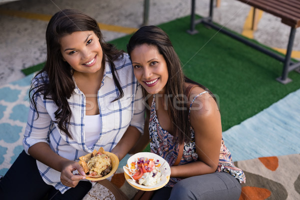 Happy friends having snacks Stock photo © wavebreak_media