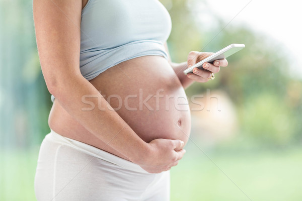 Foto stock: Mujer · embarazada · tocar · vientre · ventana · mujer