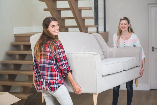 Friends shifting sofa in the new house Stock photo © wavebreak_media