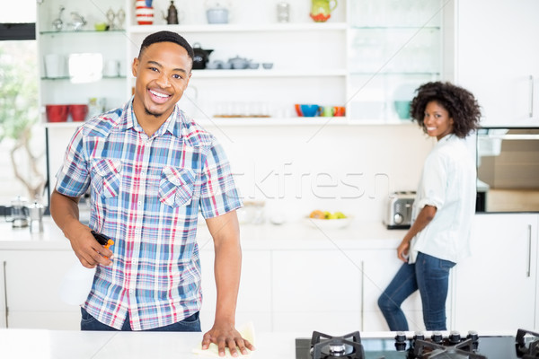 Portrait of young couple standing in kitchen Stock photo © wavebreak_media