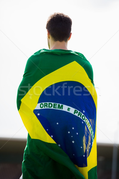 Foto stock: Atleta · bandeira · em · torno · de · corpo · estádio · homem