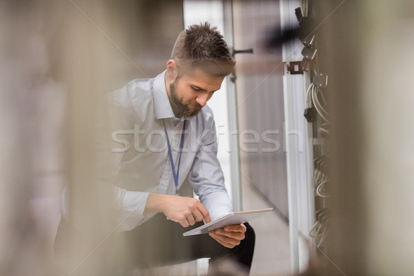 Technician using digital tablet while analyzing server Stock photo © wavebreak_media