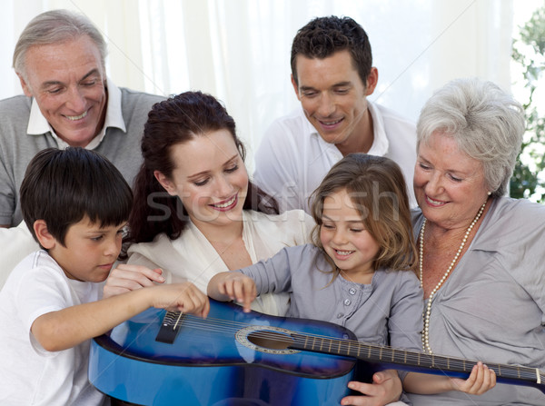 Family playing a guitar in living-room Stock photo © wavebreak_media