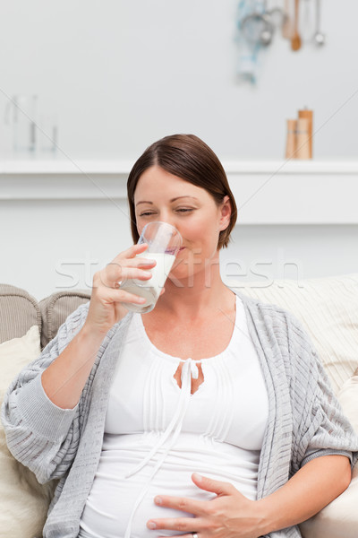 Stockfoto: Zwangere · vrouw · drinken · melk · sofa · liefde · glas
