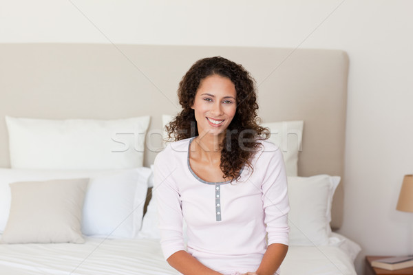 Beautiful woman lying down on her bed at home Stock photo © wavebreak_media