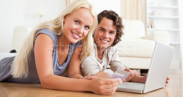 Couple booking their holidays online in their living room Stock photo © wavebreak_media