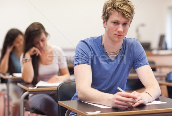 Young students having a test in a classroom Stock photo © wavebreak_media